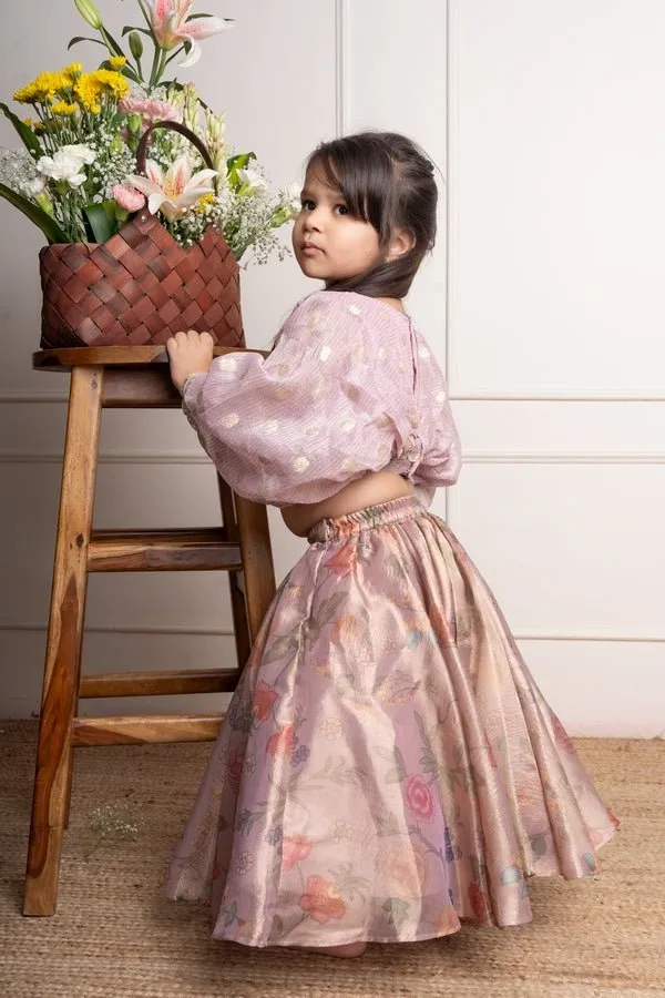 Elegant light Lavender top with white floral embroidery paired with a floral patterned pink lehenga for festive charm