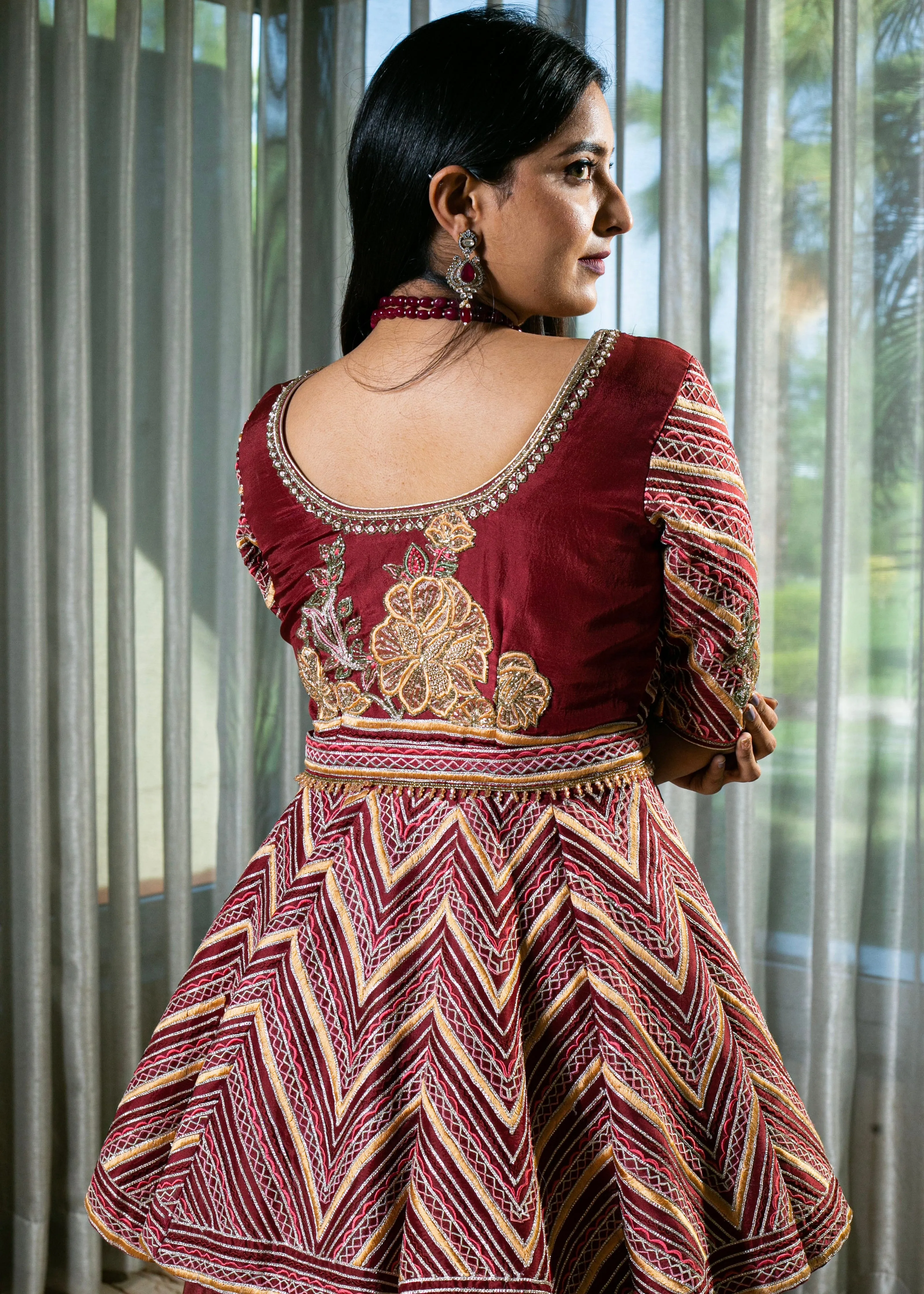 Flared Maroon Silk Lehenga with Intricate Embroidery and Handcrafted Details