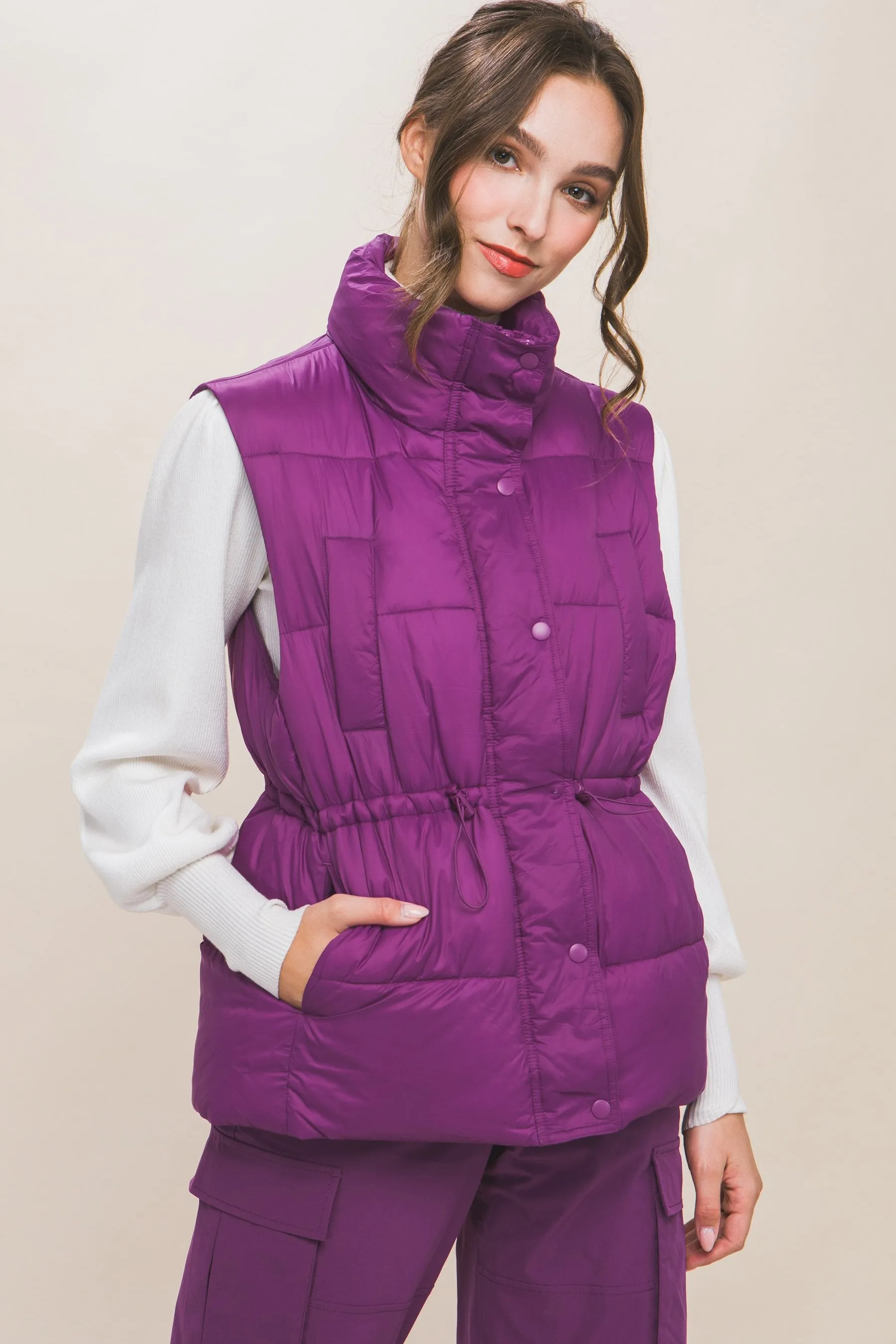 Women's Color Zip up button puffer vest with waist toggles