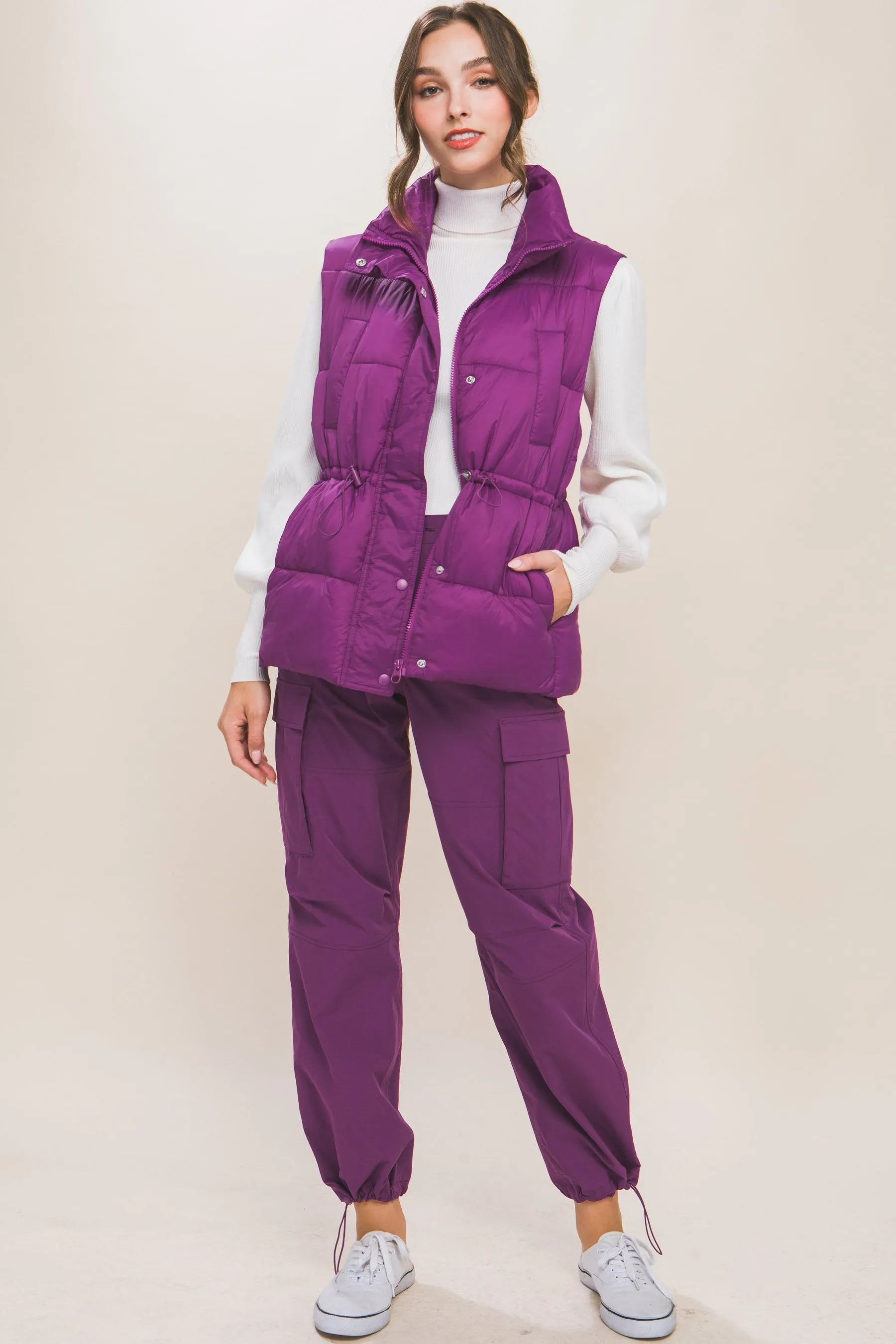 Women's Color Zip up button puffer vest with waist toggles