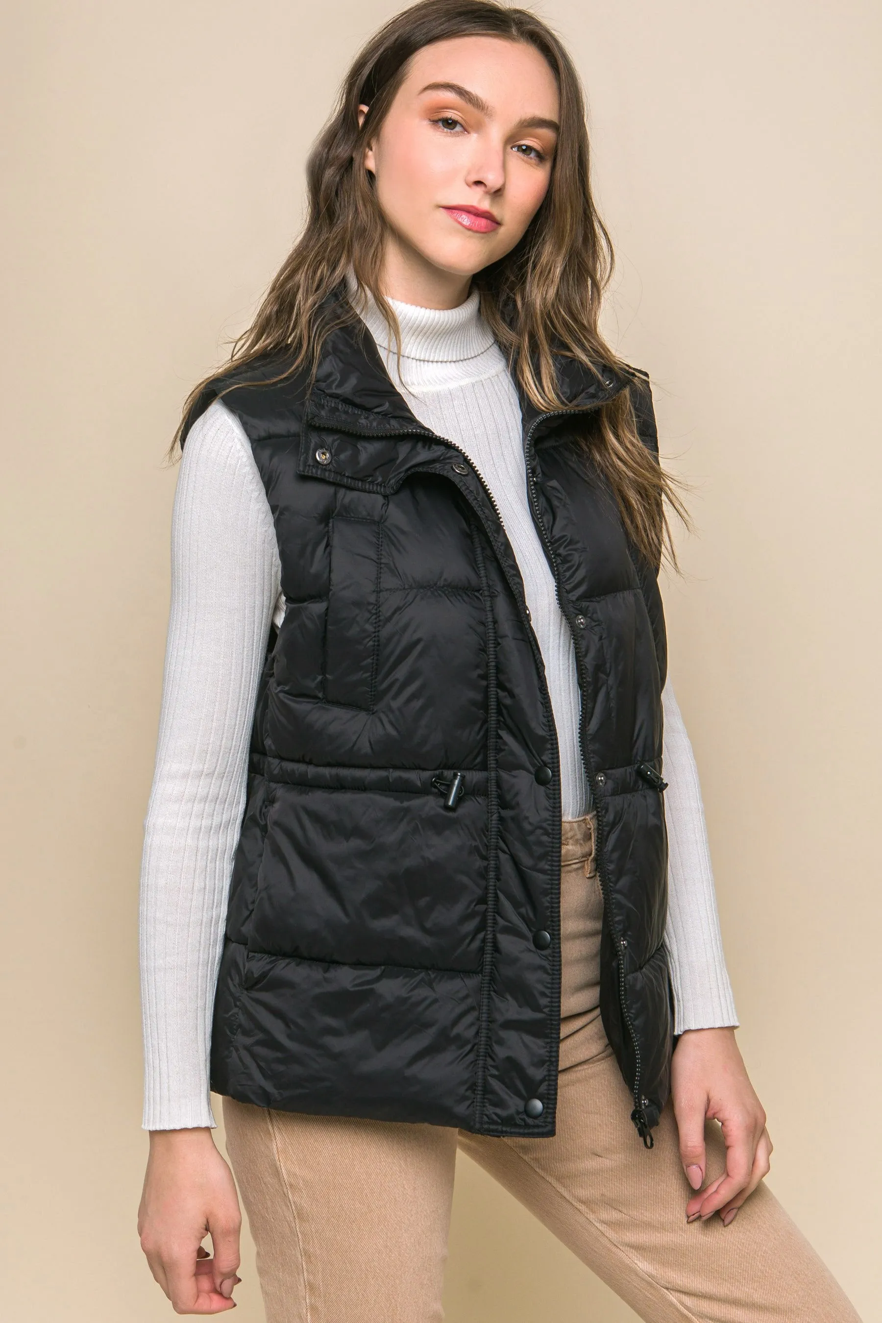 Women's Color Zip up button puffer vest with waist toggles